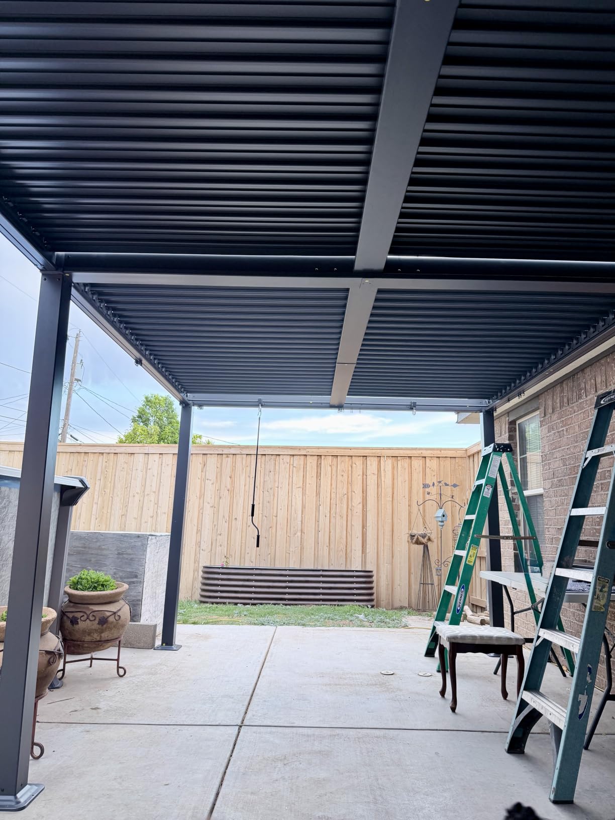 EROMMY Louvered Pergola 12x20, Outdoor Aluminum Pergola with Adjustable Rainproof Roof for Garden, Patio, Deck, Waterproof Curtains and Netting Included, Gray-Black customer photo 1