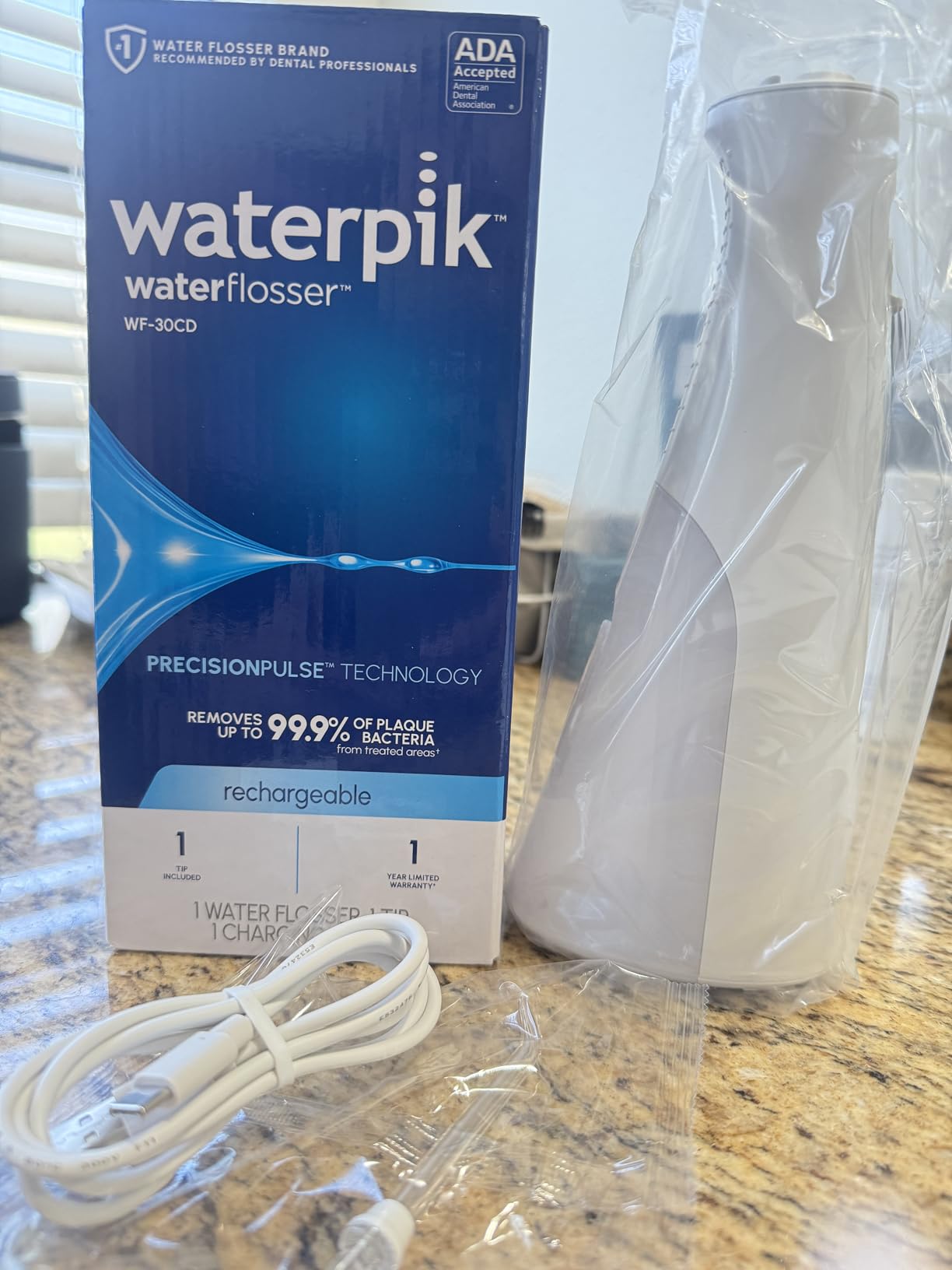 Waterpik Cordless 1100 Rechargeable Portable Water Flosser for Teeth Cleaning and Flossing, Travel, Braces Care, Healthier Gums, Waterproof for Shower, ADA Accepted, WF-30CD Black, Packaging May Vary customer photo 1